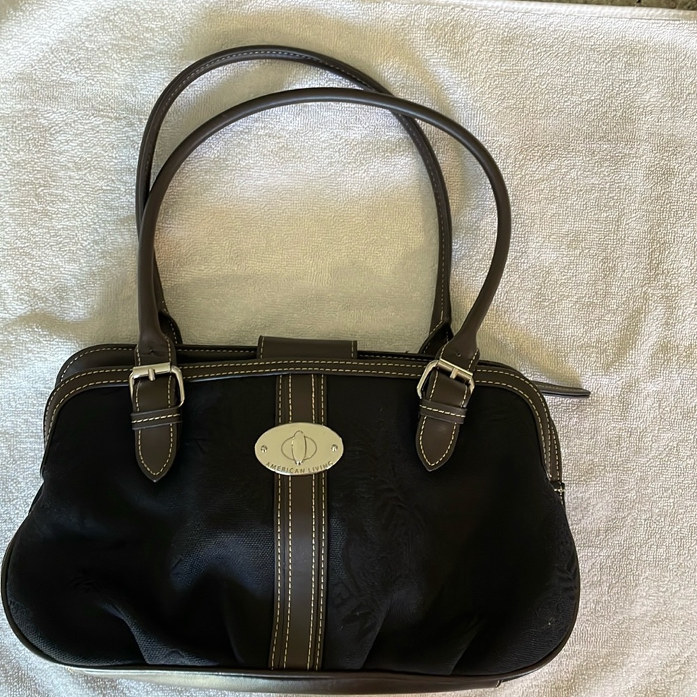 A new w/o tags American Living purse in black cloth with brown vinyl trim.